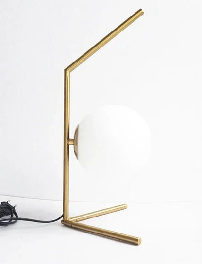 Lampe de chevet design bras dorés & boule de verre
